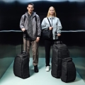 Two travellers, male and female, with Db Journey Travel Gear